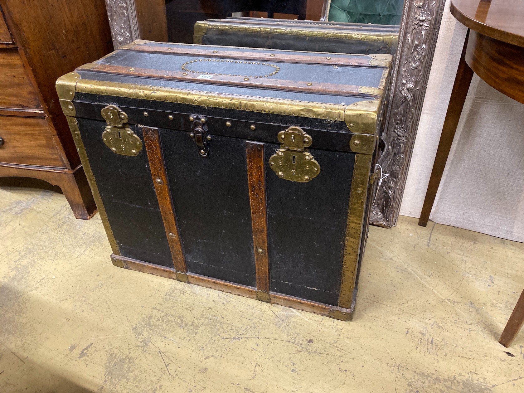 A Victorian brass and oak mounted black leather travelling trunk, length 75cm, depth 36cm, height 62cm